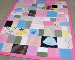 quilt made out of baby clothes