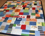 quilt with baby clothes