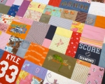 quilt with baby clothes