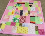 quilt made from old baby clothes