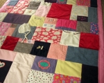 quilt made from baby clothes