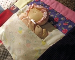 quilt made from baby clothes