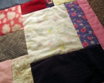 quilt made from baby clothes