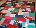 quilt with baby clothes