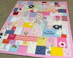 quilt made from old baby clothes